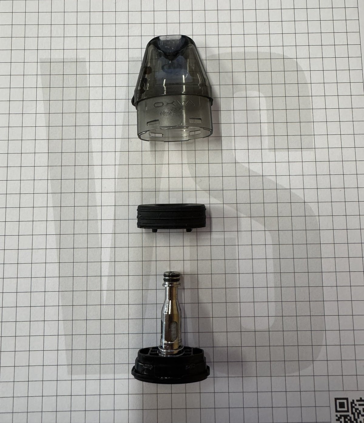Realaufnahme geöffneter OXVA NeXLIM Pod - Blick auf Coils